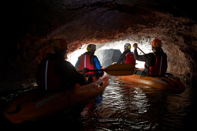 From Bled: Black Hole Kayaking - A mine cart, headlamps, and sit-on-top kayaking in Black Hole mines