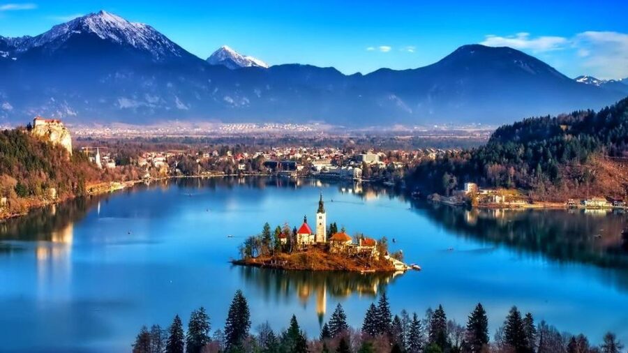 Bled Island and its bell tower on Lake Bled, with the Karavanke behind